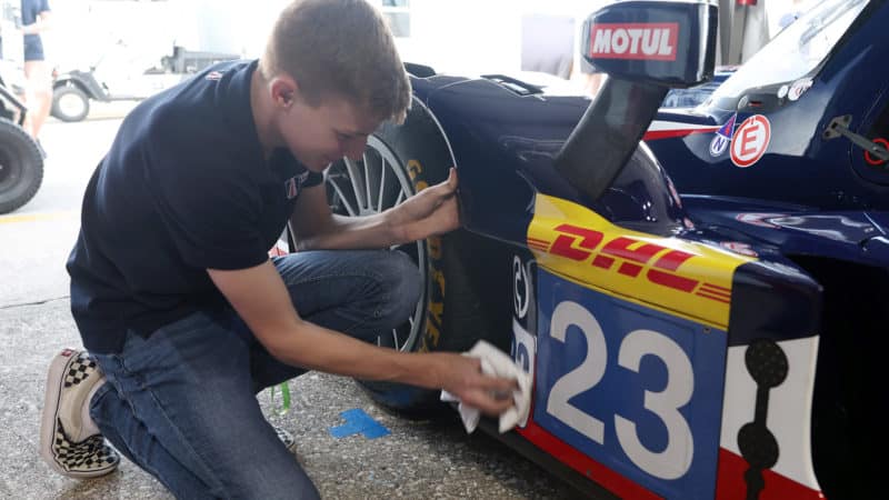 Josh Pierson cleans his No23 United Autosports LMP2 car