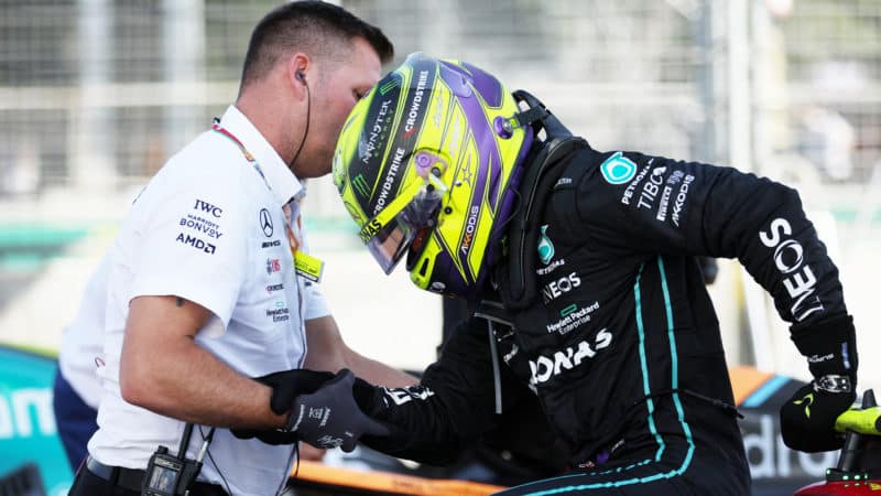 Lewis Hamilton is helped out of his Mercedes after the 2022 Azerbaijan GP