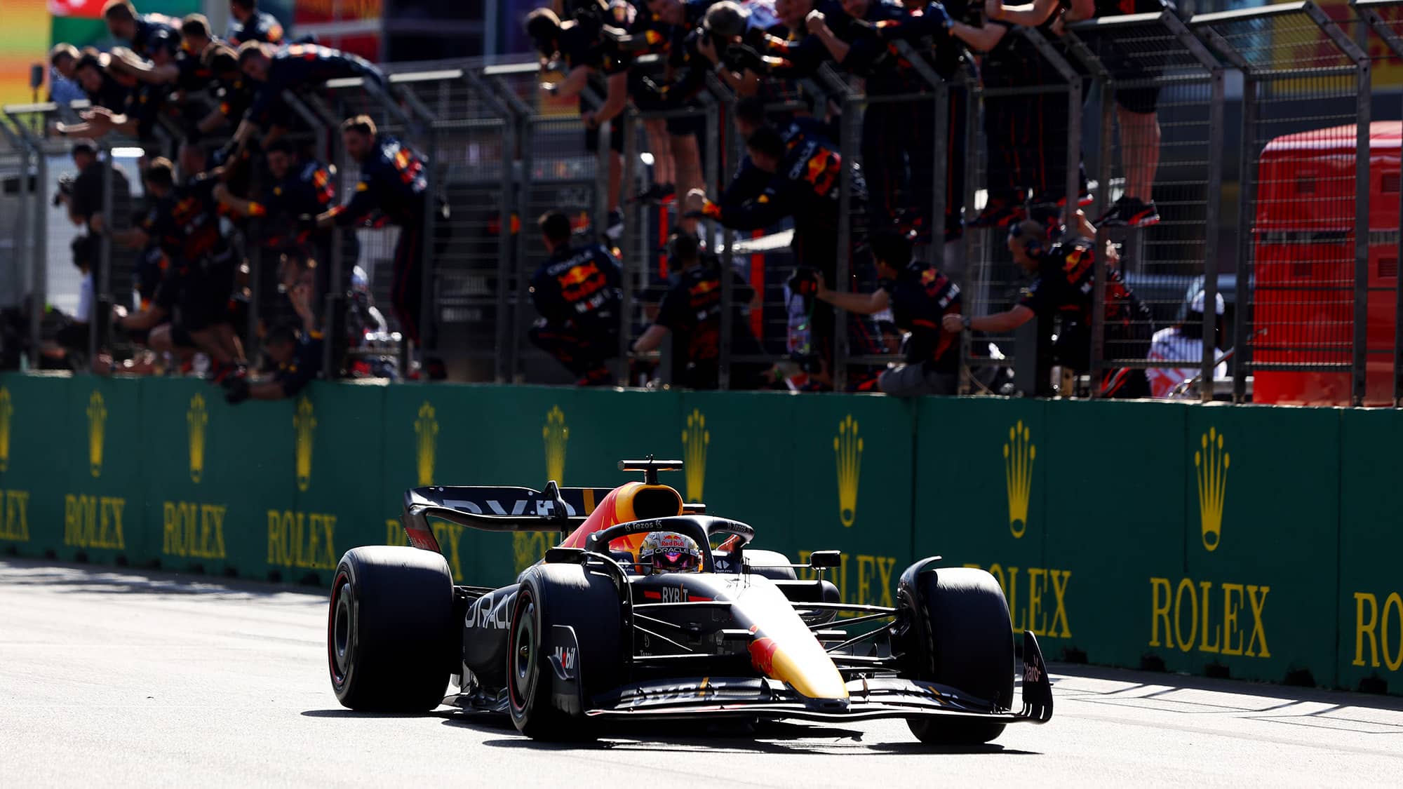 Max Verstappen is cheered by team as he crosses the line to win the 2022 Azerbaijan GP