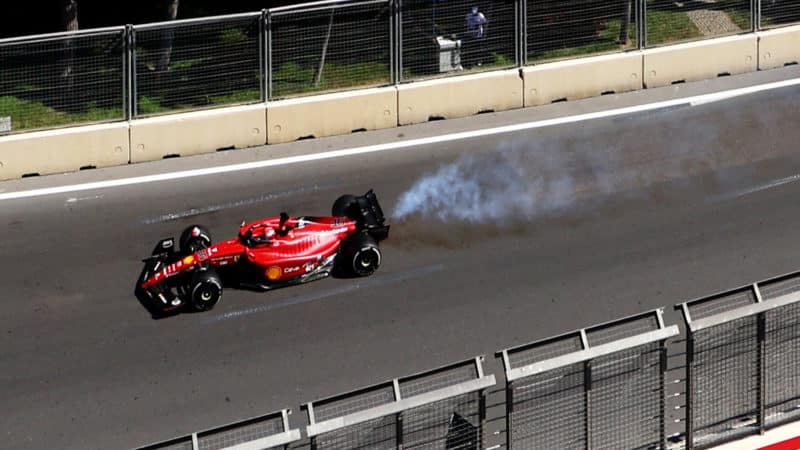 Smoke pours from the rear of Charles Leclerc Ferrari at the 2022 Azerbaijan GP