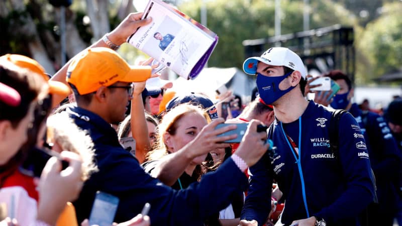 Williams' Canadian driver Nicholas Latifi signs autographs to the fans as he arrives for the 2022 Formula One Australian Grand Prix at the Albert Park Circuit in Melbourne on April 10, 2022. - -- IMAGE RESTRICTED TO EDITORIAL USE - STRICTLY NO COMMERCIAL USE -- (Photo by Con Chronis / AFP) / -- IMAGE RESTRICTED TO EDITORIAL USE - STRICTLY NO COMMERCIAL USE -- (Photo by CON CHRONIS/AFP via Getty Images)