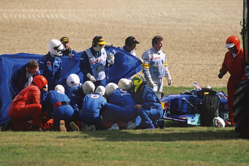 Medics with Pedro Diniz after his Sauber rolled at the Nurburgring