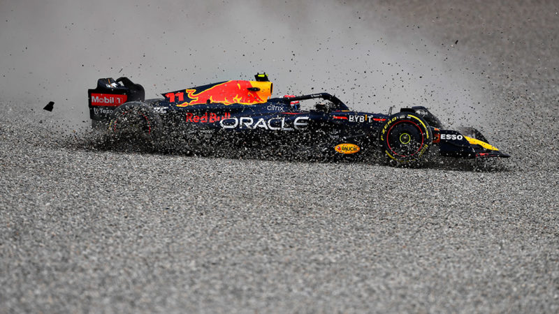 Sergio PErez spins through the gravel at the start pof the 2022 Austrian Grand Prix
