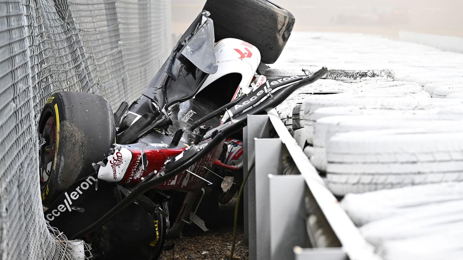 Alfa Romeo of Zhou Guanyu is trapped between safety barriers at the 2022 British Grand Prix