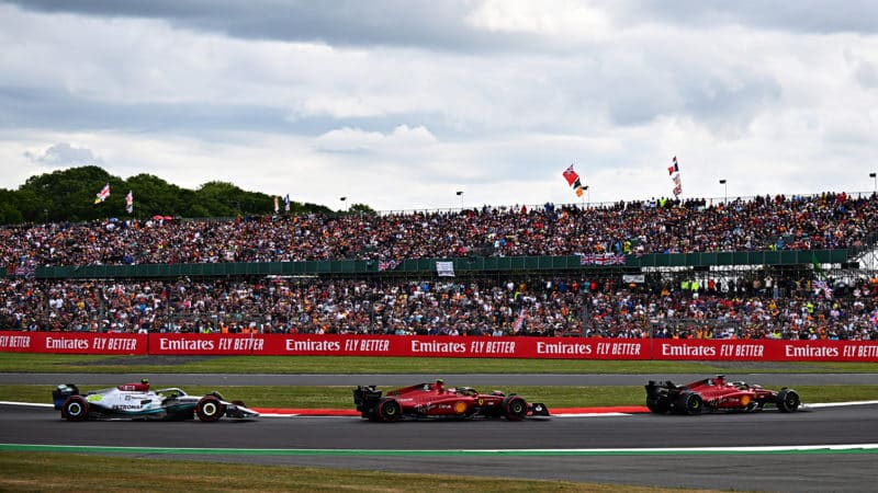 Charles Leclerc leads Carlos Sainz and Lewis Hamilton behind the safety car in the 2022 British Grand Prix