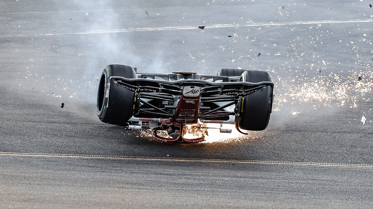 Sparks fly from Zhou Guanyu's car after it flipped at Silverstone