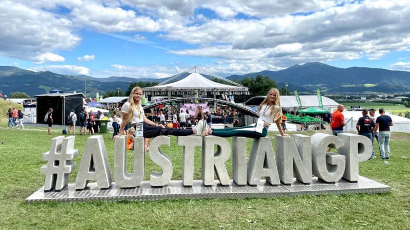 Desiree and Virginia Stubbe on an Austrian GP sign