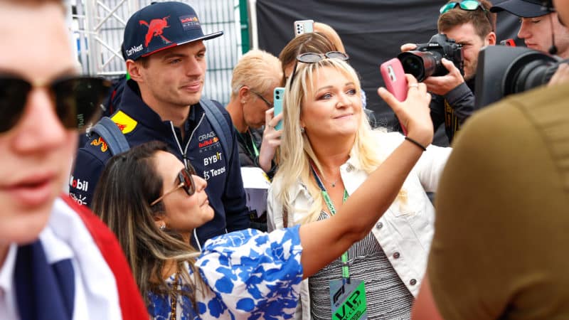 Fans pose for selfies with Max Verstappen at Silverstone ahead of the 202 British Grand Prix