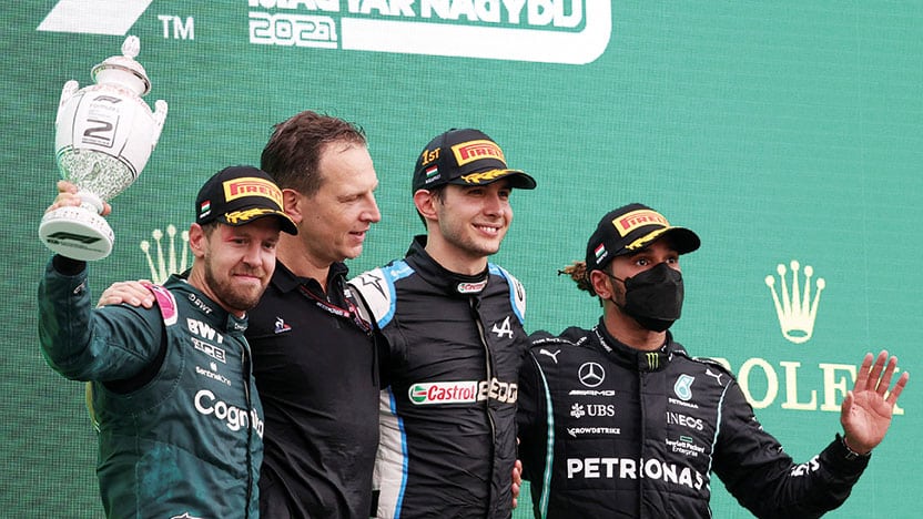 Esteban Ocon celebrates winning the 2021 Hungarian Grand Prix on the podium