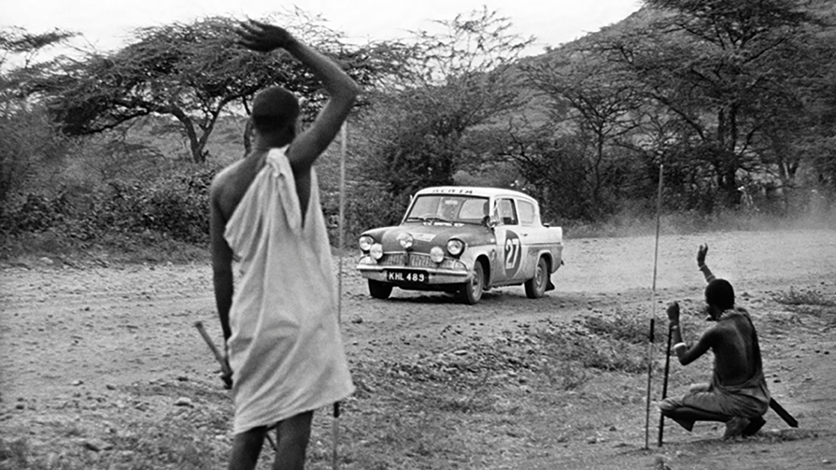 Masai Men Waving at Racecar