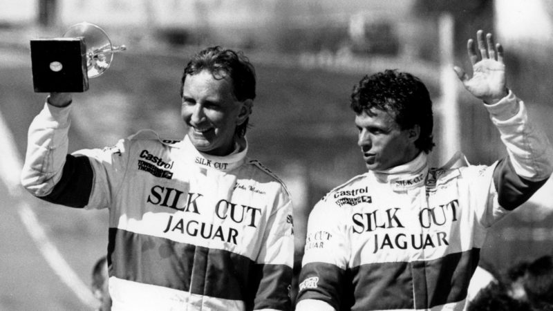 Jaguar drivers John Watson and Jan Lammers wave at Jarama in 1987