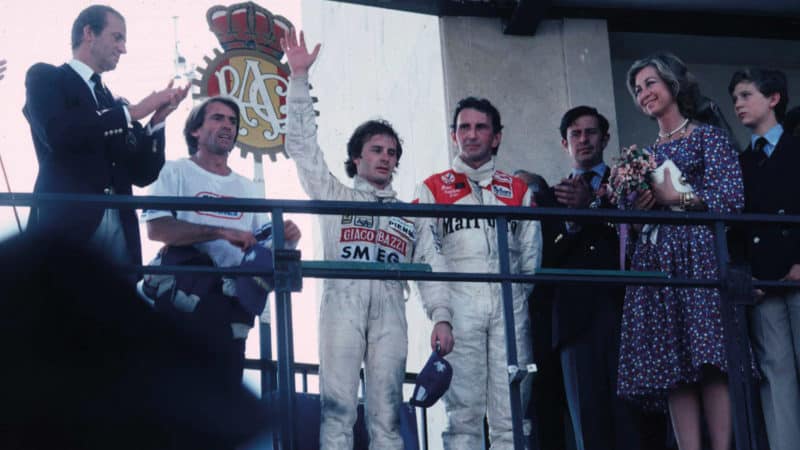John Watson and Gilles Villeneuve on the podium at Jarama after the 1981 Spanish GP