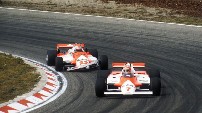 John Watson leads the damaged McLaren of Mario Andretti at the 1981 Dutch Grand Prix