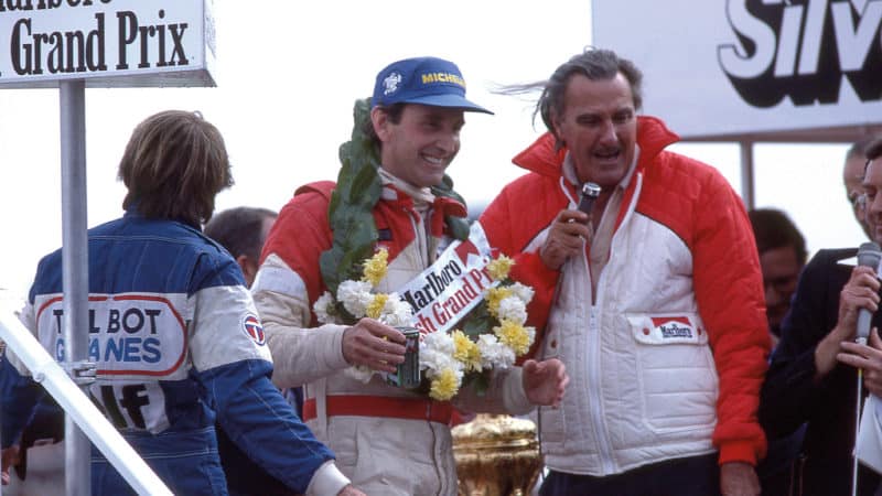 John Watson on the podium after winning the 1981 British GP