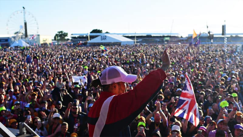 Lewis Hamilton waves to the Silverstone crowd after the 2022 British Grand Prix