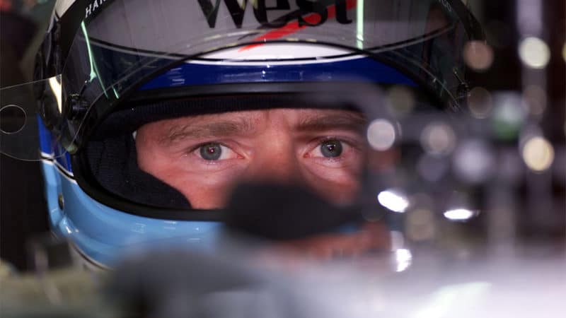 Mika Hakkinen sits in his McLaren F1 car in 1999