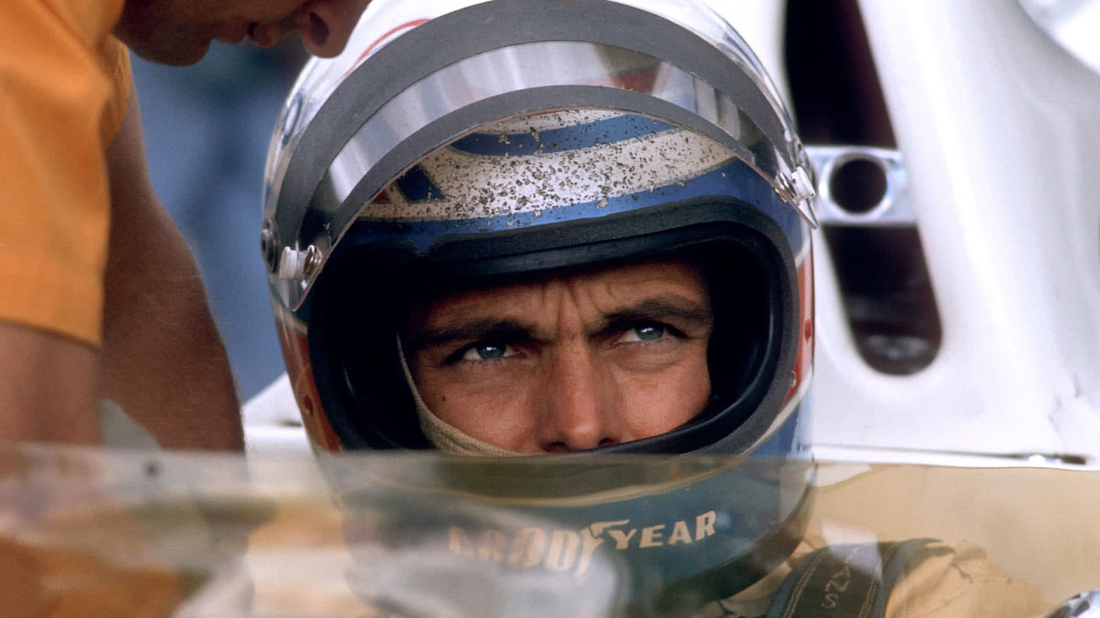 Peter Revson with helmet on