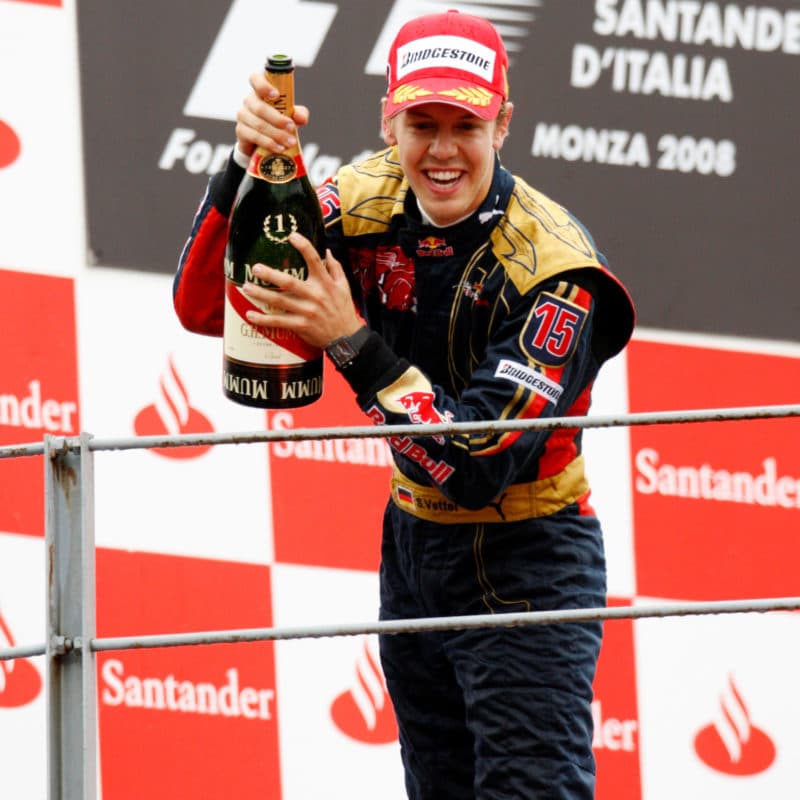 Sebastian-Vettel-on-the-podium-after-winning-his-first-Grand-Prix-in-Monza-2008