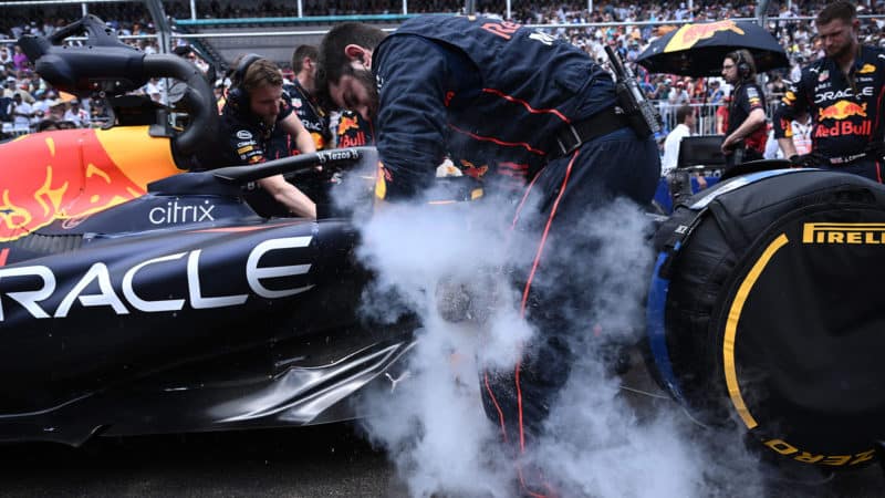 Steam from dry ice around a Red Bull car