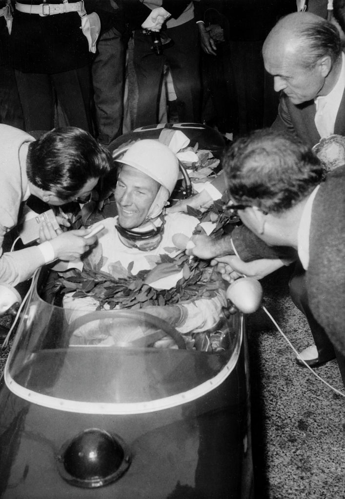 Stirling Moss in Lotus 18 cockpit at Monaco in 1961