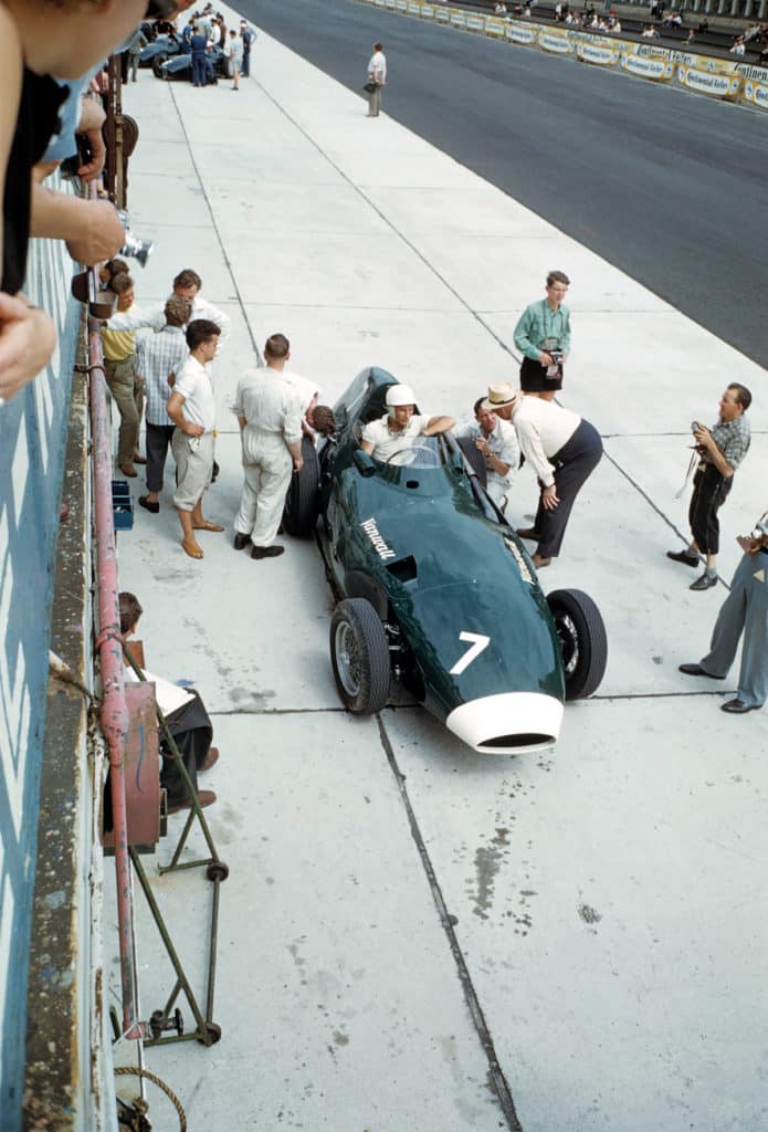 Tony Vandervell leans in to hear Stirling’s thoughts at the Nürburgring, 1958