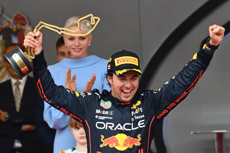 Sergio Perez celebrates winning the Monaco Grand Prix on the podium