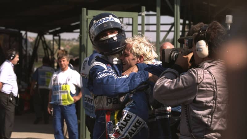 Arrows-F1-driver-Damon-Hill-embraces-WIlliams-driver-Jacuqes-Villeneuve-at-the-1997-Hungarian-GP