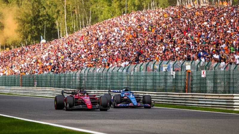 Charles Leclerc passes Fernando Alonso in the 2022 Belgian Grand Prix