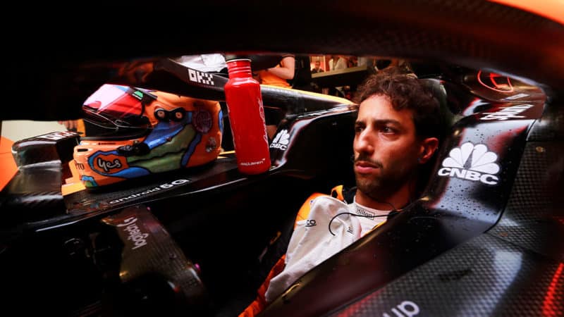 Daniel-Ricciardo-sits-in-his-McLaren-F1-car-at-the-2022-Hungarian-GP