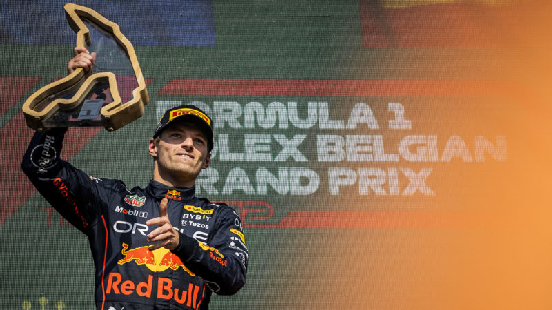Max Verstappen raises his trophy after winning the 2022 Belgian Grand Prix