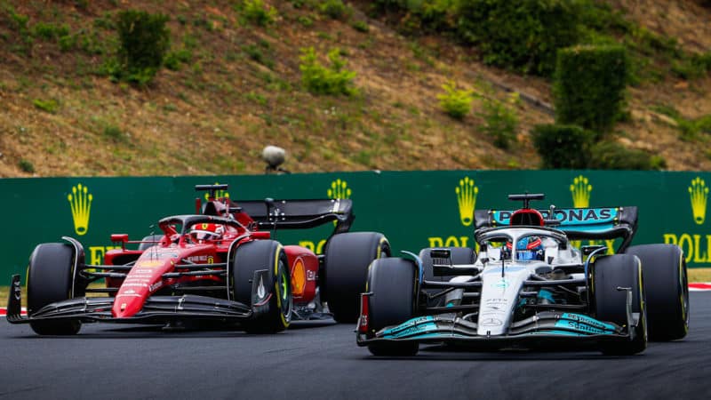Mercedes-F1-driver-George-Russell-races-Ferrari-F1-driver-Charles-Leclerc-at-the-2022-Hungarian-GP