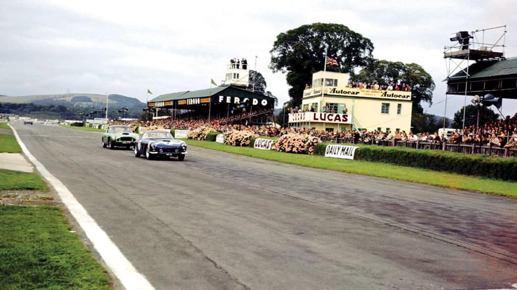 Moss heads Innes Ireland’s Aston Martin DB4 GT during the 1960 RAC Tourist Trophy at Goodwood