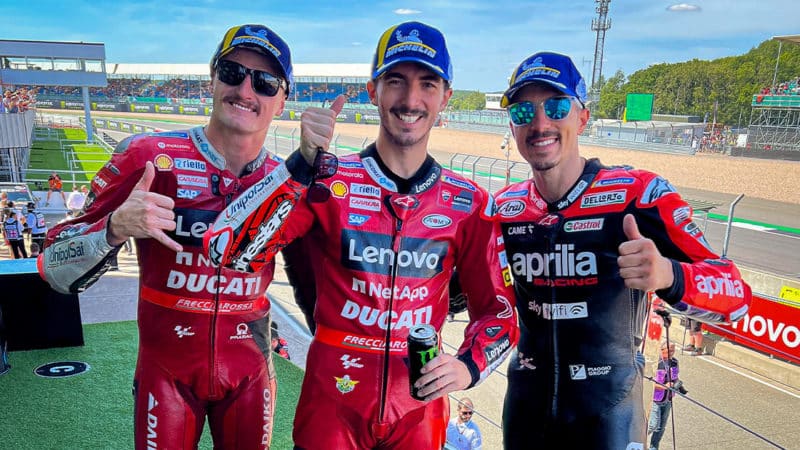 MotoGP riders Francesco Bagnaia, Jack Miller and Maverick Vinales celebrate on the podiu of the 2022 British GP at Silverstone