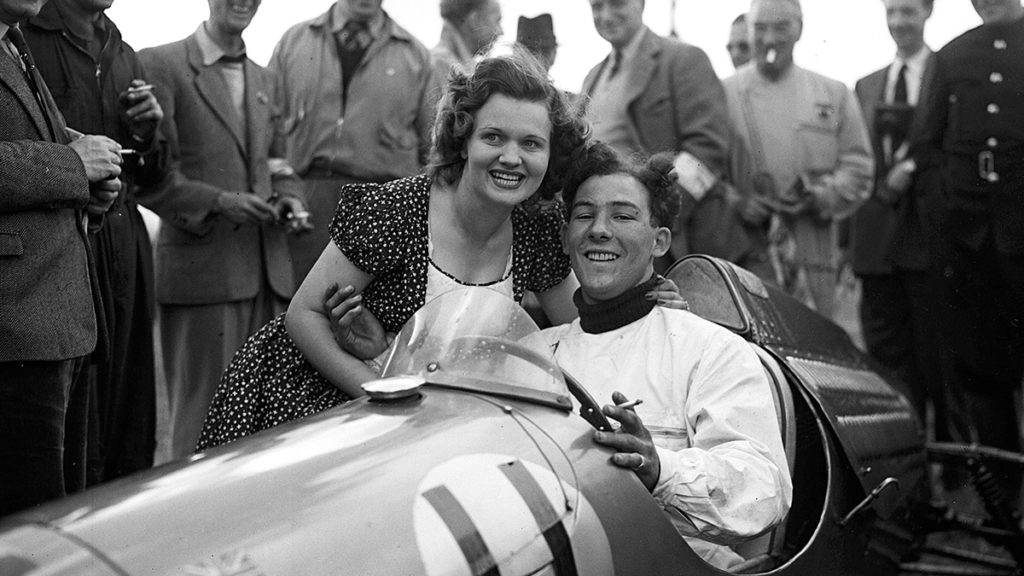 Paula Cooper, wife of John Cooper, congratulates Moss at Silverstone in August 1950