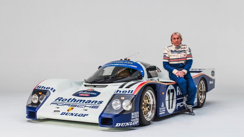 Porsche-Group-C-driver-Derek-Bell-sits-with-a-962