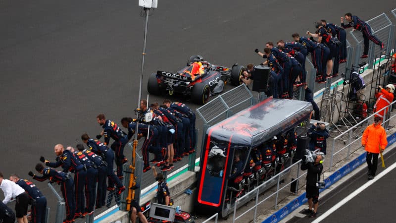 Red Bull team cheer Max Verstappen as he wins the 2022 Hungarian Grand Prix