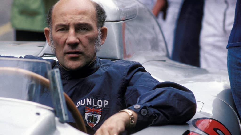 Stirling Moss, BRDC patch still prominent in 1977