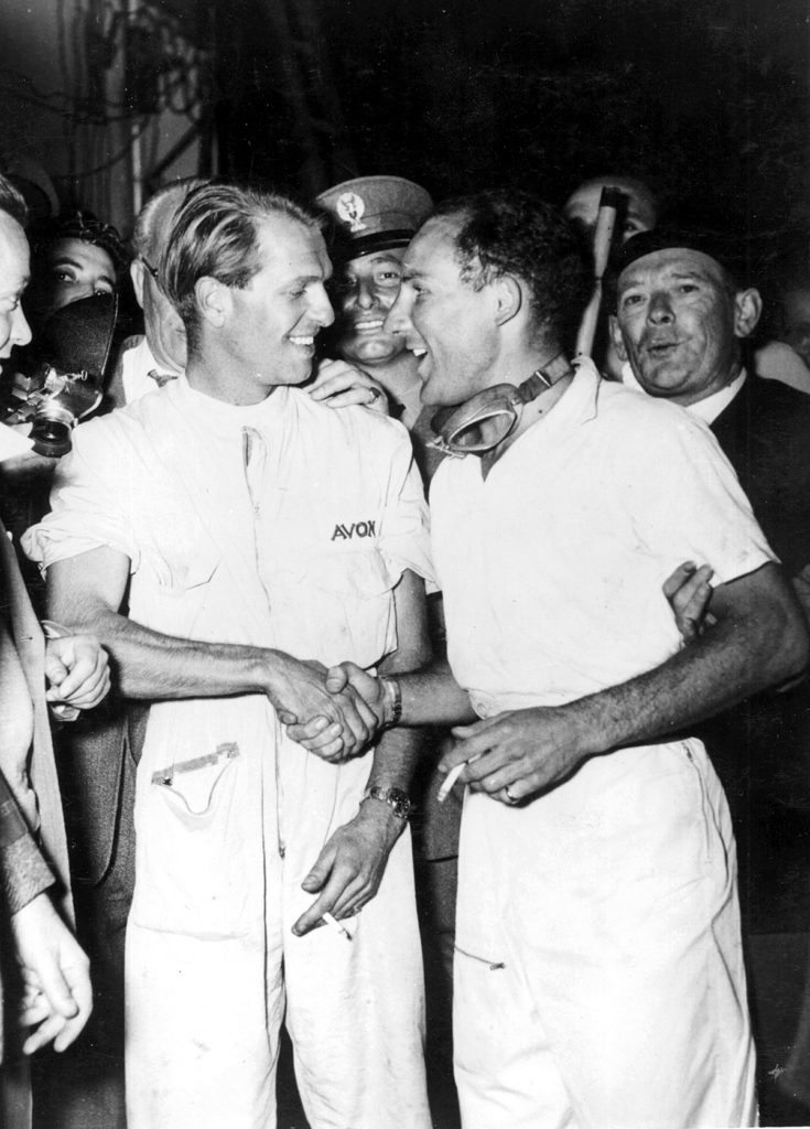 Stirling Moss and Peter Collins share a smile