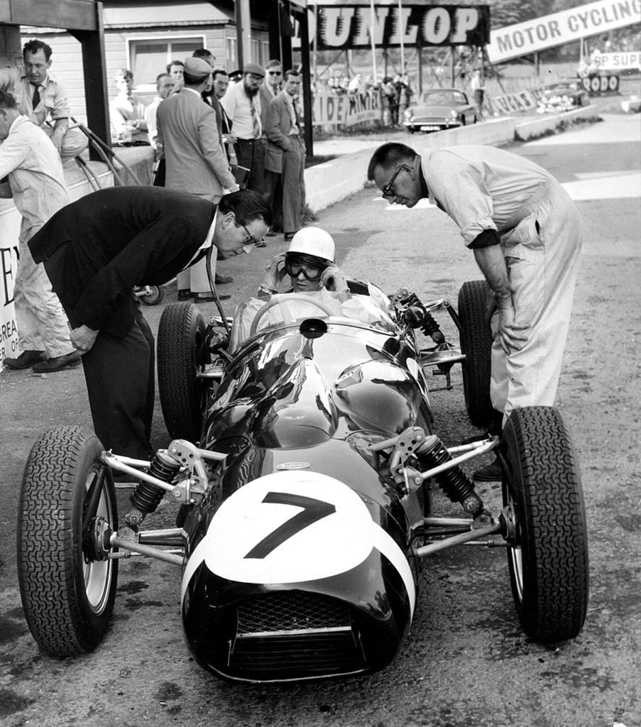 Stirling Moss in the pits during the 1961 Oulton Park Gold Cup