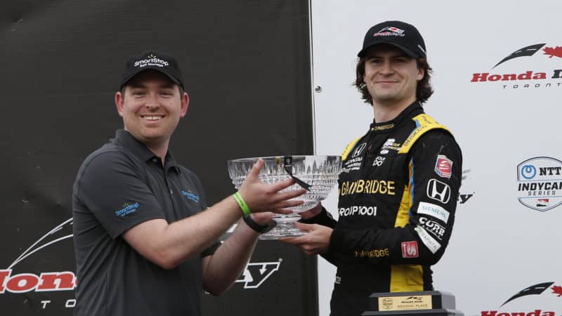 Colton Herta receives second place trophy at the 2022 IndyCar Toronto race