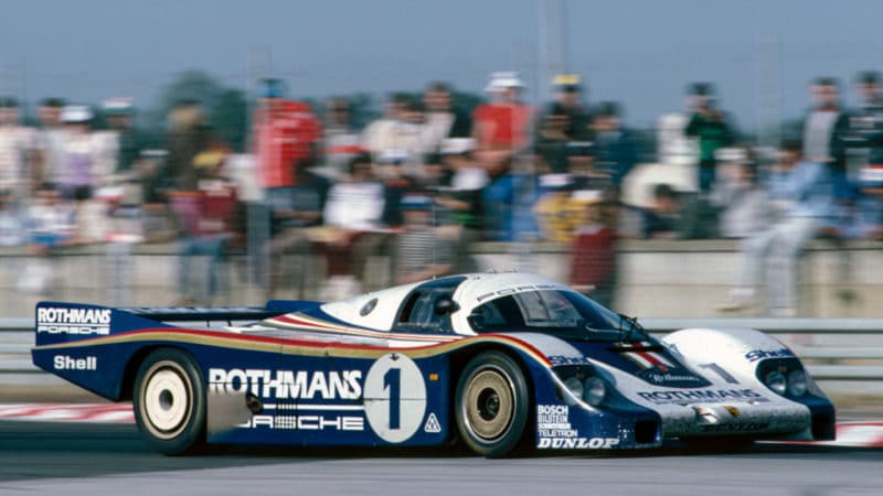 Derek-bell-driving-a-Porsche-956-at-le-Mans-1982