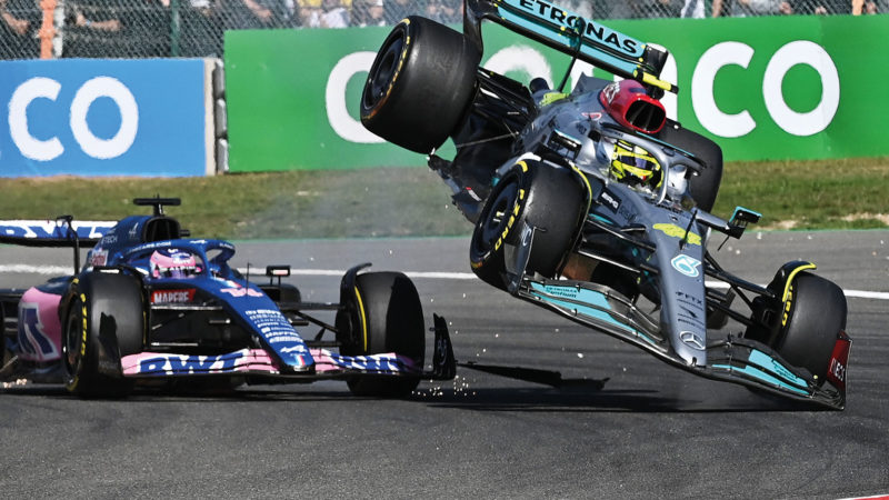 Hamilton's Mercedes is flipped into the air after contact with Alonso's Alpine