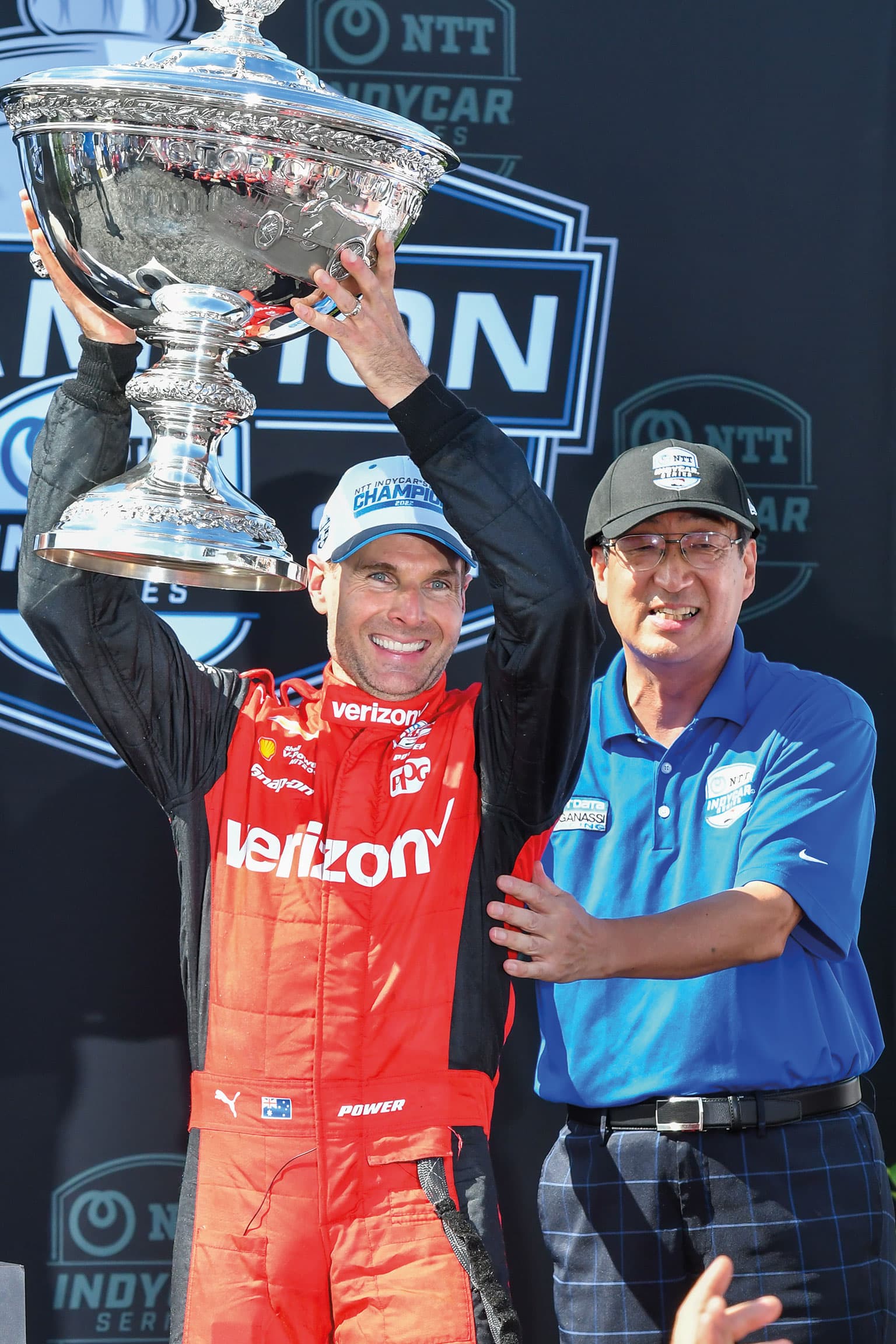 Will Power holds the 2022 IndyCar championship trophy