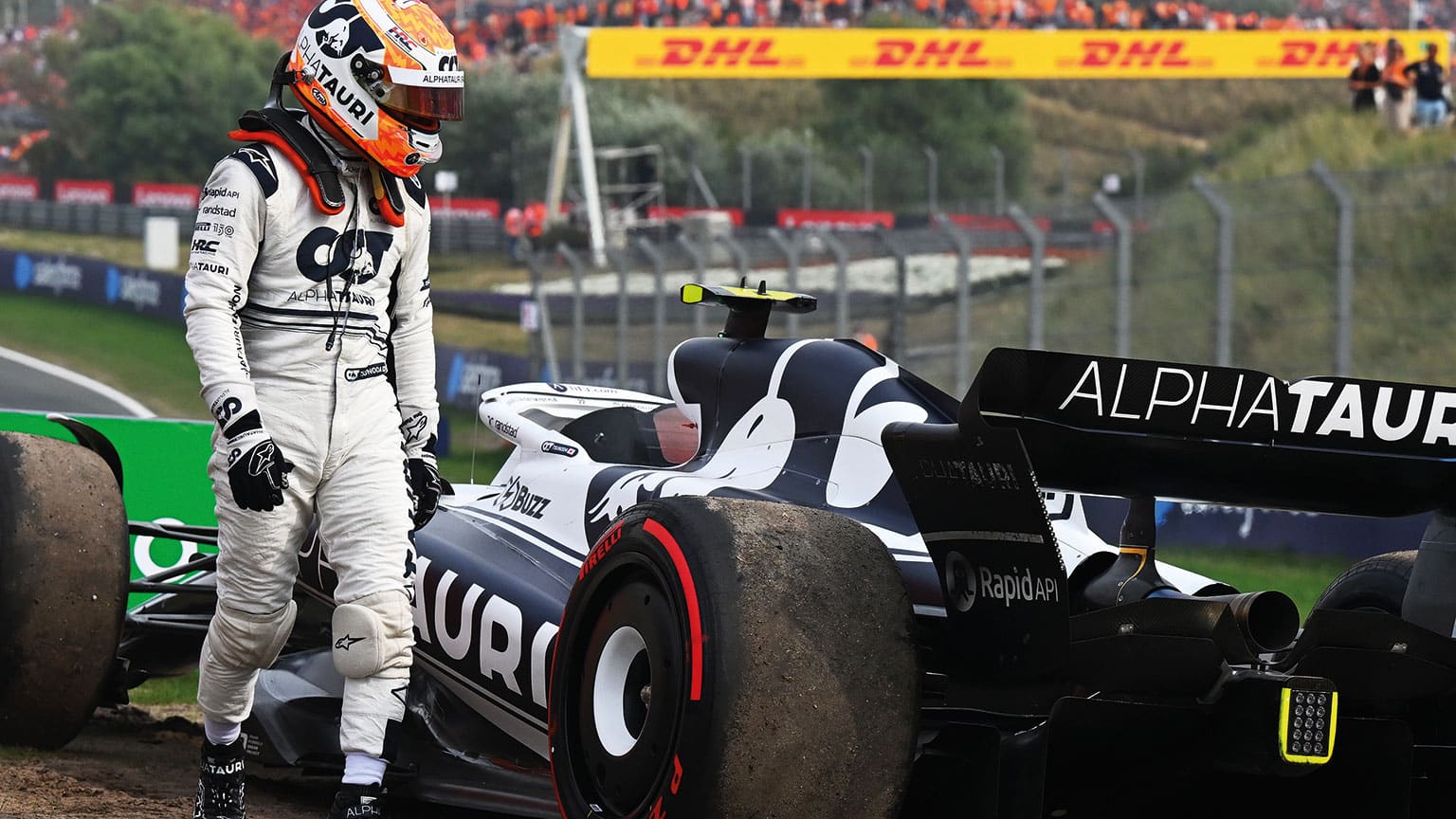 Yuki Tsunoda walks away from his car after retiring form the 2022 Dutch Grand Prix