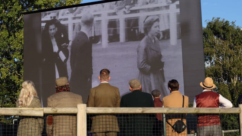 Goodwood Revival spectators watcha. video of Wueen Elizabeth II at the racecourse