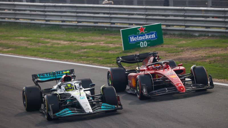 Lewis Hamilton is overtaken y Charles Leclerc in the 2022 Dutch Grand Prix