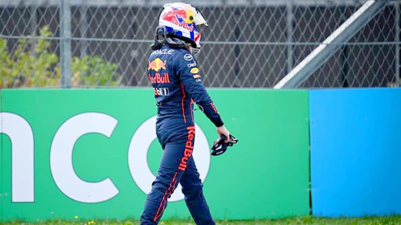 Max Verstappen walks back to the pits after his car stopped in practice at Zandvoort