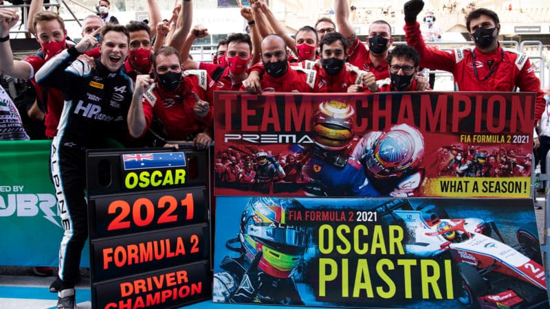 Oscar Piastri celebrates winning the 2021 F2 championshiop with his Prema team