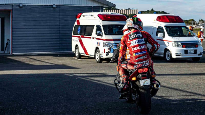 Pecco Bagnaia hitches a lift to the medical centre after crashing at 2022 MotoGP Motegi round