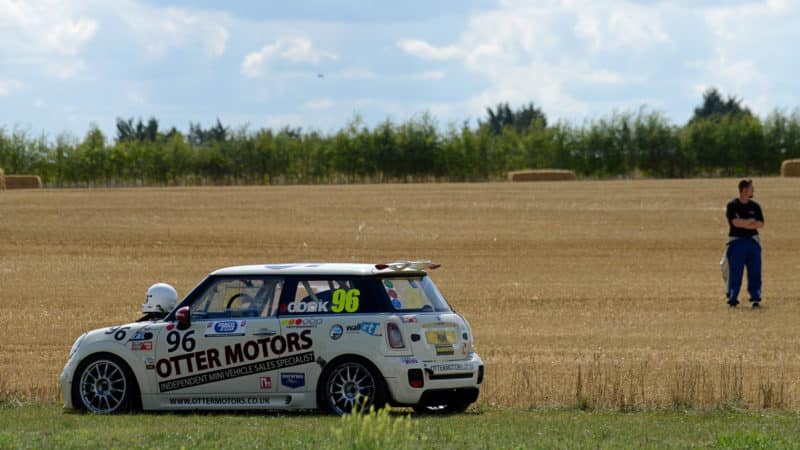 Tom Cook watches Castle Combe racing after spinning off in his Mini